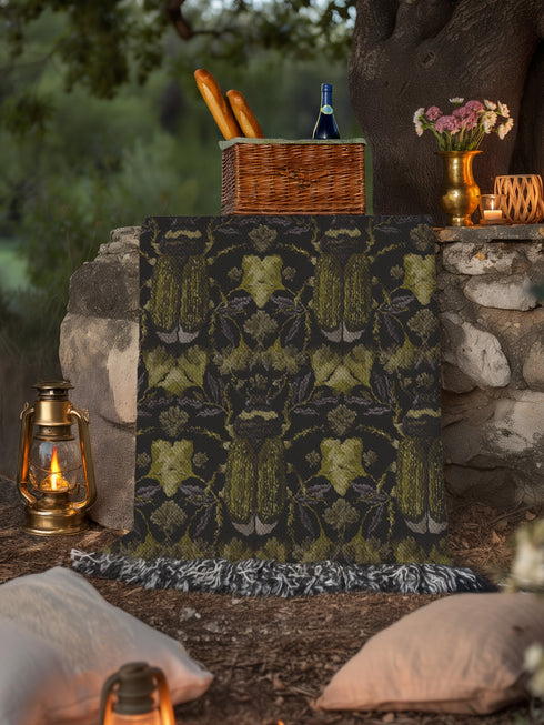 Luxurious woven cotton throw blanket featuring symmetrical scarab beetle pattern in olive green on black background with white fringe trim. Perfect for dark academia, gothic, or cottagecore decor as wall hanging or cozy throw. Mystical home gift.
