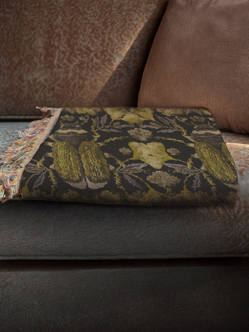 Luxurious woven cotton throw blanket featuring symmetrical scarab beetle pattern in olive green on black background with white fringe trim. Perfect for dark academia, gothic, or cottagecore decor as wall hanging or cozy throw. Mystical home gift.