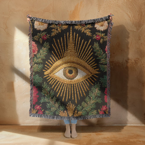 Drape your sanctuary in arcane elegance with our All-Seeing Eye woven cotton blanket. A talismanic piece of gothic botanical decor, this tapestry throw is a testament to woven sorcery, designed for the modern mystic and the discerning scholar of the esoteric.
Behold the celestial gaze of the All-Seeing Eye, rendered in radiant gold and rich earth tones, a timeless symbol of wisdom, intuition, and divine protection. This is not a printed image, but an intricate tapestry jacquard-woven from 100% pure, dyed c