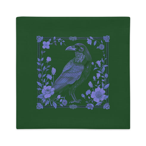 Emerald green throw pillow cover featuring a violet raven illustration surrounded by intricate floral designs, perfect for gothic or dark academia decor.