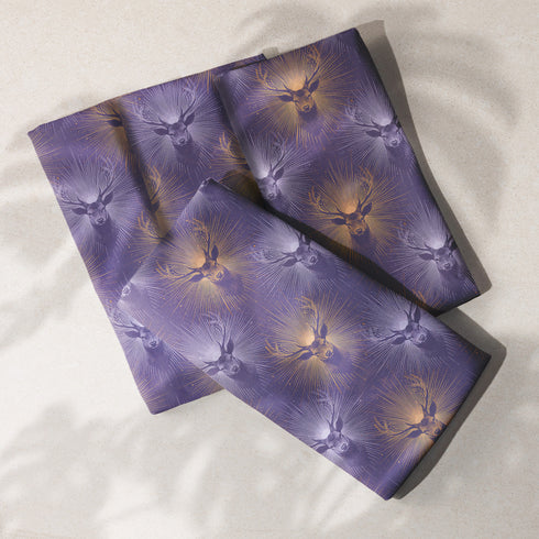 Set of four slate blue dining napkins featuring alternating gold and silver ravens in flight with botanical accents, sized 18x18 inches.