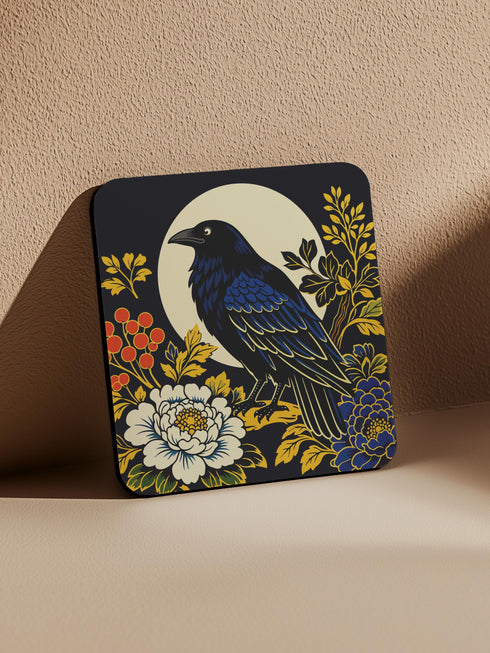 Grimoire and Goblet set of 4 glossy square coasters featuring Chinoiserie style raven illustrations. 1: Navy blue with blue floral pattern and raven. 2: Navy background with black raven, white full moon, and red berries. 3: Moss green background with blue bird and yellow chrysanthemums. 4: Black background with teal-winged raven and red peonies. MDF hardboard with cork backing. Flat vector botanical art style.