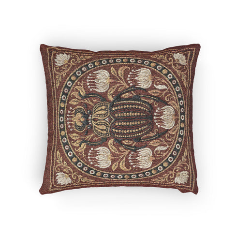 Square 17 by 18 inch jacquard woven throw pillow, woven identically on both faces and closed with a clean finished edge. A large detailed scarab beetle in black, gold, and dark brown sits at the center inside a dotted circular border, surrounded by symmetrical Art Nouveau vines and cream lotus flowers on a rust red ground. Small white floral motifs sit in each corner. The design is woven flat into the cotton blend cloth, with visible thread texture and a soft sheen in the ground.