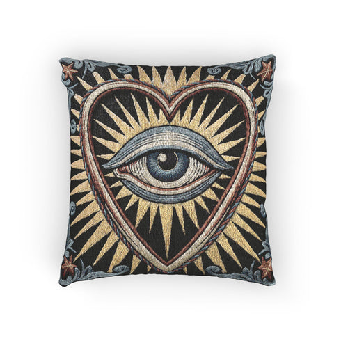 Square 17 by 18 inch jacquard woven throw pillow, woven identically on both faces and closed with a clean finished edge. On a solid black ground, a large blue evil eye sits inside a golden sunburst heart. Gold, pale blue, cream, and rust threads form the design, with dusty blue acanthus leaves curling around the heart and small rust stars in each corner. The design is woven flat into the cotton blend cloth, with visible thread texture and a heavy tapestry hand.