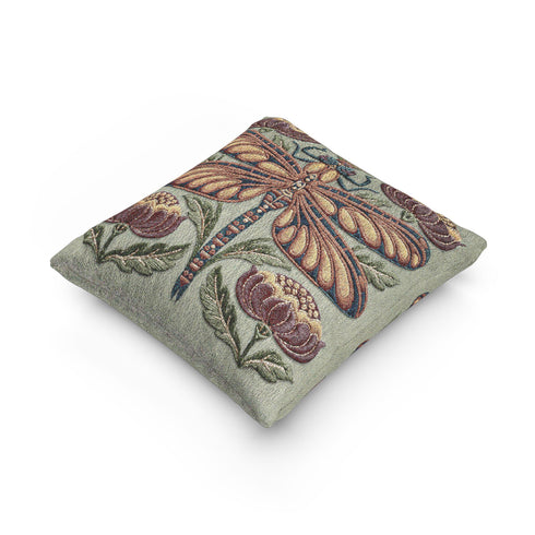 Square 17 by 18 inch jacquard woven throw pillow, woven identically on both faces and closed with a clean finished edge. A mirror symmetrical dragonfly fills the center of a sage green ground, its four long wings outlined in rust copper and filled with apricot and mustard, barred in slate blue along the leading edge. Plum peonies with ochre centers sit in each corner, and olive leaf sprays rise from the base. The ground has a soft sheen and the motif shows matte woven thread.