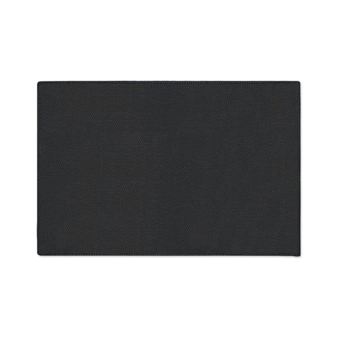 Rectangular black doormat with a low loop polyester pile and black edge trim framed by a thin gold rule, printed flat to imitate raised embroidery. Two almond shaped eyes with layered blue lids, cream whites, and blue irises ringed in gold gaze outward. Cream serif lettering with gold inlines reads THE EYE WATCHES. Gold scrollwork fills each corner, and a small gilded bird with outstretched wings sits at the bottom center.